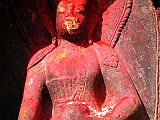 Manaslu 00 09 Kathmandu Boudhanath Statue Closeup Around the base of the Kathmandu�s Boudhanath Stupa�s circular mound are 108 niches, each containing the Dhyani Buddha Akshobhya, with a decidedly Hindu flavour. Akshobhya is blue with his right hand touching the earth while his left hand holds a begging bowl. He is the Buddha of the East and is dedicated to helping you overcome hatred, anger and aversion.